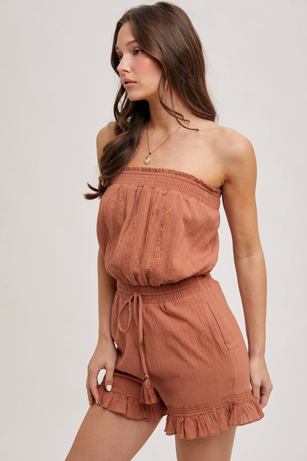 SMOCKED TUBE TOP RUFFLED HEM DRAWSTRING ROMPER