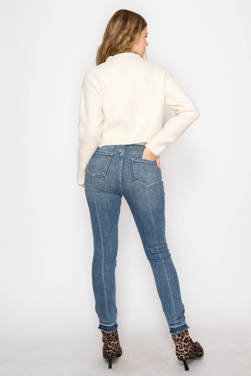 HIGH RISE CROSSOVER SKINNY JEANS
