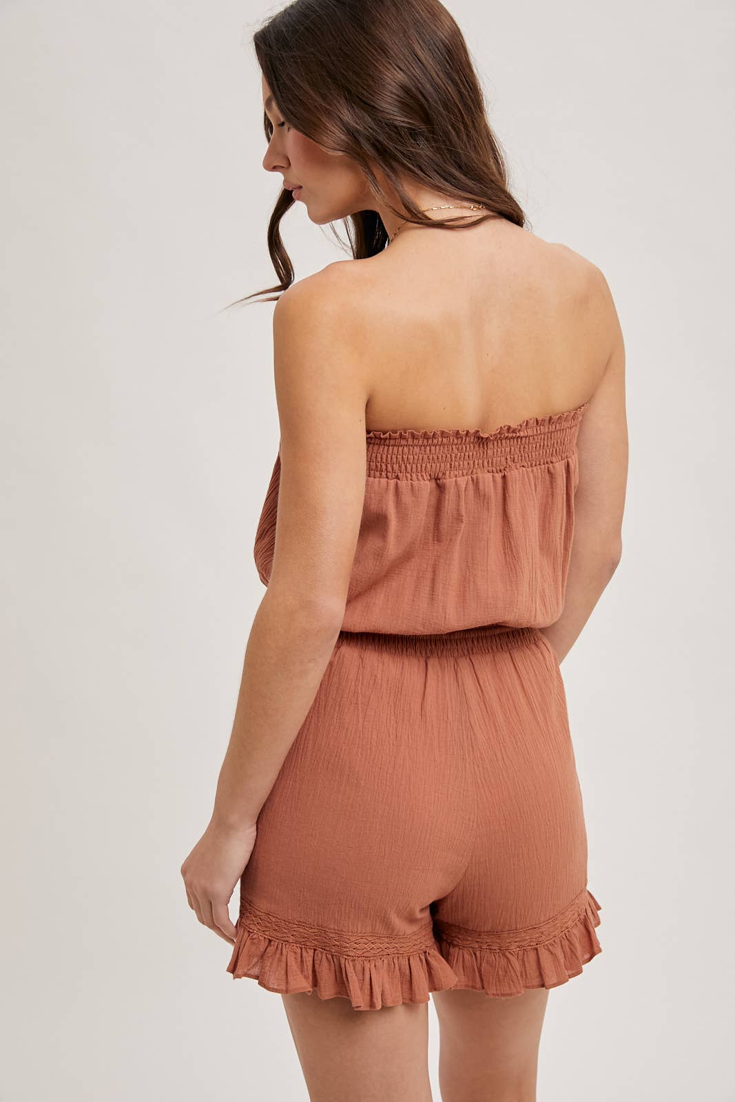 SMOCKED TUBE TOP RUFFLED HEM DRAWSTRING ROMPER